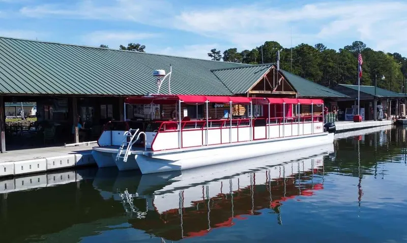 Slide: The Image of 2024 Aloha Pontoon 50' Water Taxi docked at a marina with red canopy. - 3