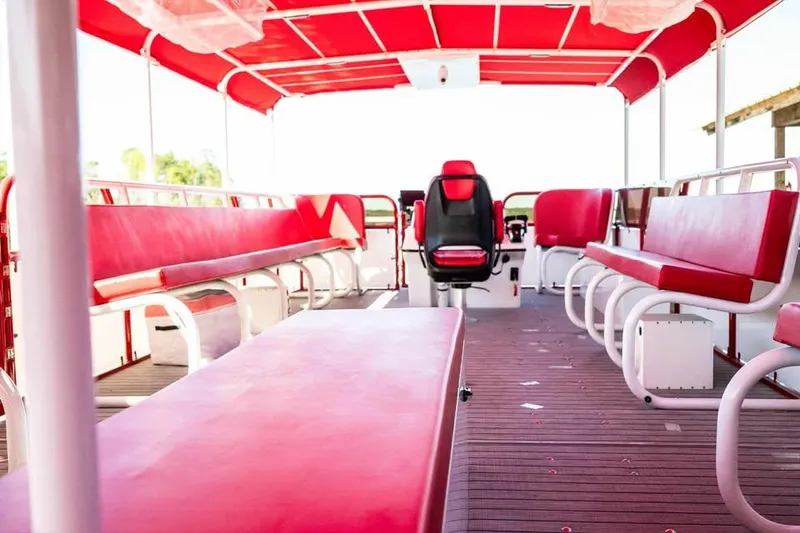 Slide: The Image of 2024 Aloha Pontoon 50' Water Taxi with red seating and canopy. - 6
