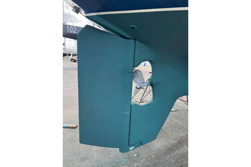 Slide: The Image of Rudder and propeller of 2002 Pacific Seacraft 40 sailboat in dry dock. - 13