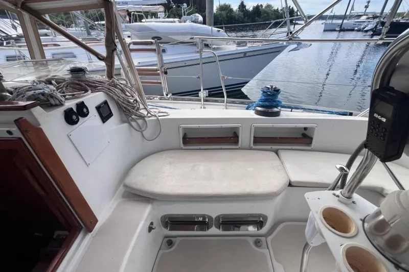 Slide: The Image of Cockpit of 2002 Pacific Seacraft 40 sailboat with seating and navigation equipment. - 21