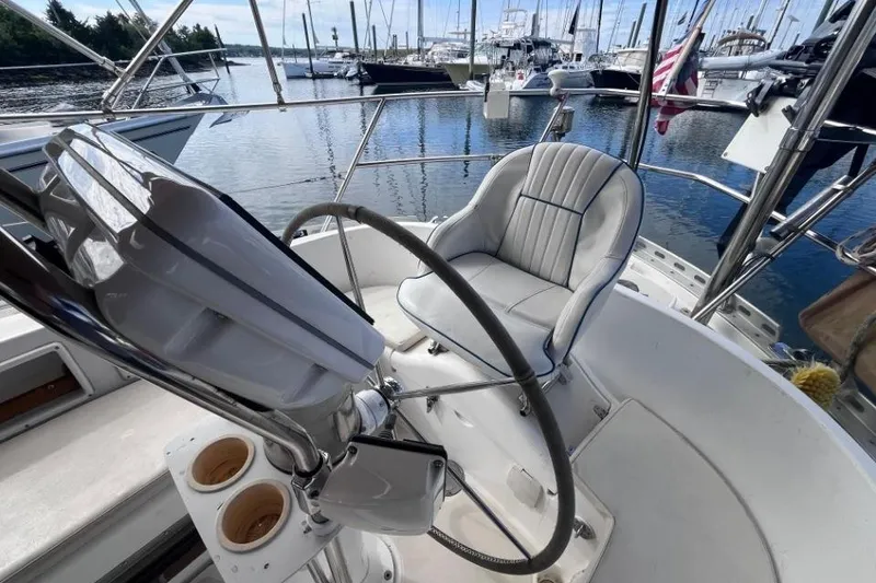 Slide: The Image of Cockpit of 2002 Pacific Seacraft 40 sailboat with steering wheel and cushioned seat. - 22