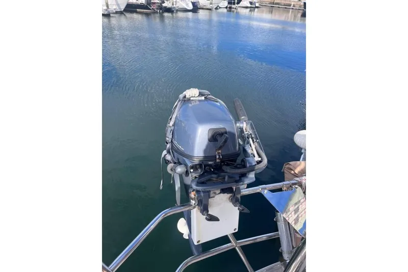 Slide: The Image of Outboard motor on a 2002 Pacific Seacraft 40 sailboat, docked in a marina. - 23