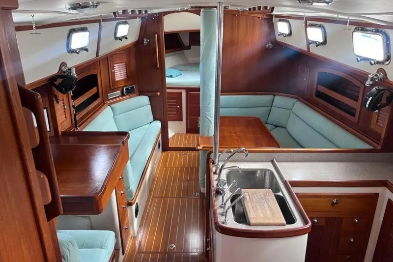 Slide: The Image of Interior of a 2002 Pacific Seacraft 40 sailboat with wood finish and seating area. - 37