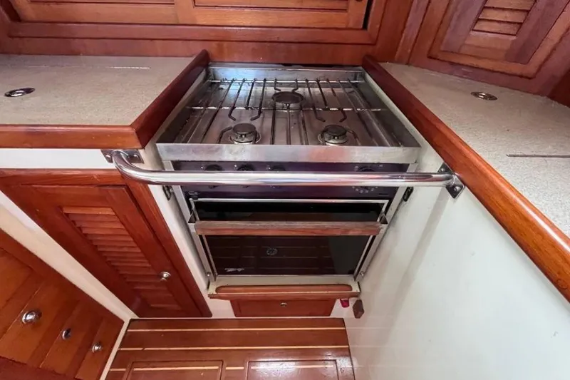 Slide: The Image of Galley kitchen in 2002 Pacific Seacraft 40 sailboat with stove and oven. - 38