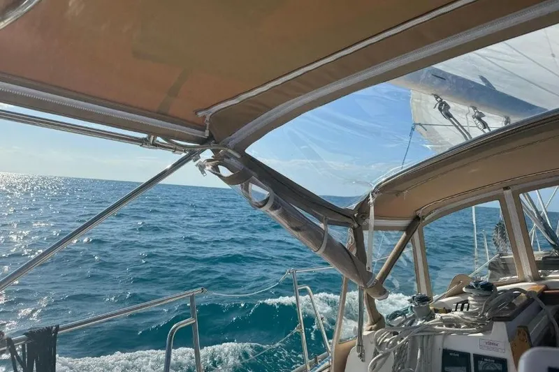 Slide: The Image of Sailing view from a 2002 Pacific Seacraft 40, showcasing ocean waves and clear skies. - 9