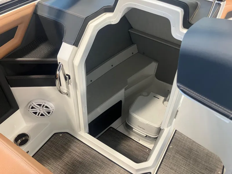 Slide: The Image of Interior cabin of 2025 Cobalt R6 boat with compact toilet and speaker. - 14