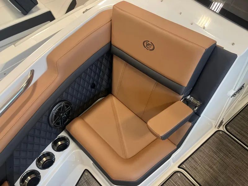 Slide: The Image of Luxurious seating in 2025 Cobalt R6 boat with tan upholstery and cup holders. - 21