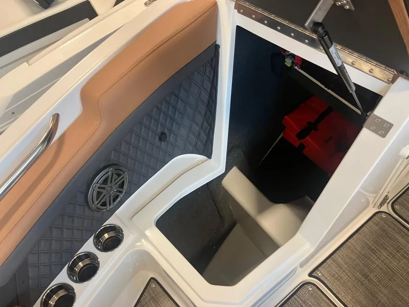 Slide: The Image of Interior of 2025 Cobalt R6 boat showing storage compartment and seating area. - 22