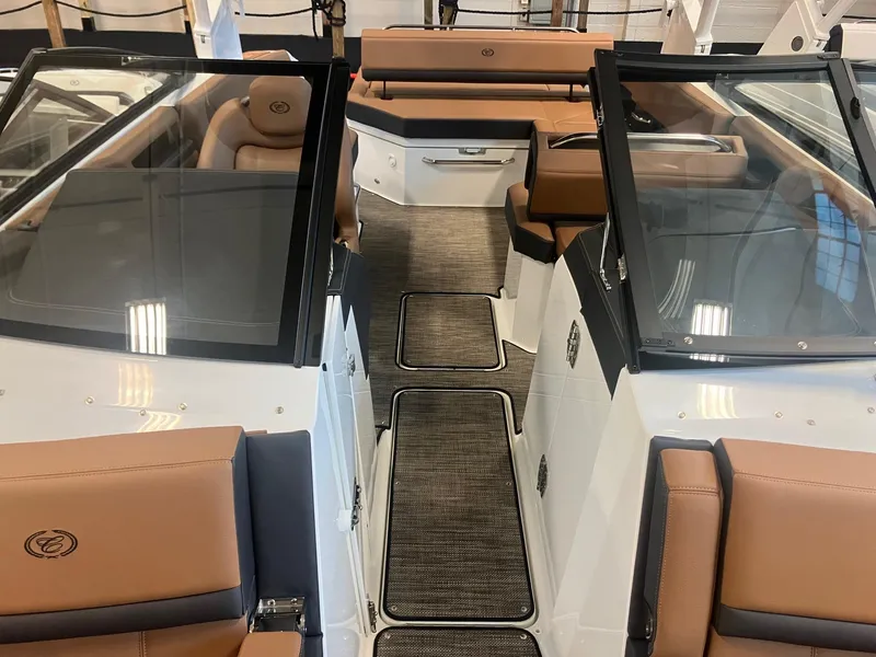 Slide: The Image of 2025 Cobalt R6 boat interior with tan leather seats and sleek design. - 23