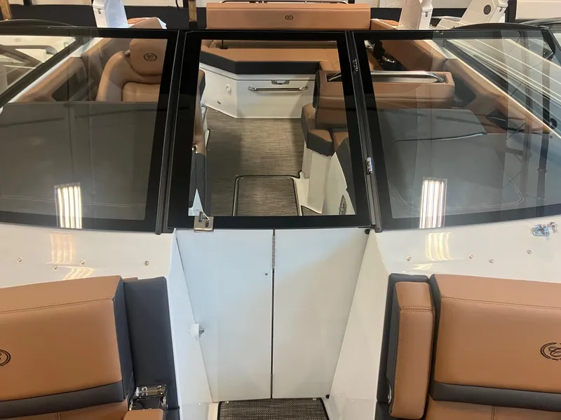 Slide: The Image of 2025 Cobalt R6 boat interior with tan leather seats and sleek design. - 24