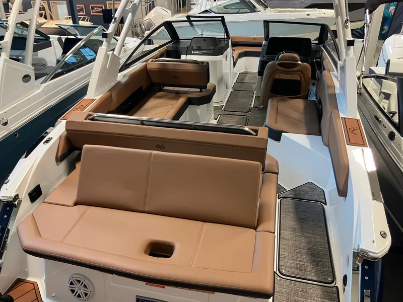 Slide: The Image of 2025 Cobalt R6 boat interior with tan leather seating and modern design. - 4
