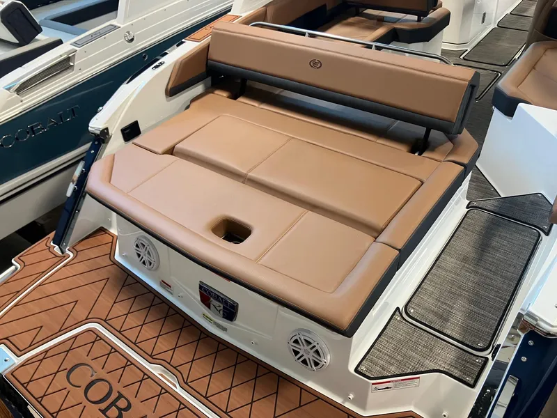 Slide: The Image of 2025 Cobalt R6 boat with tan seating and teak-style flooring. - 5