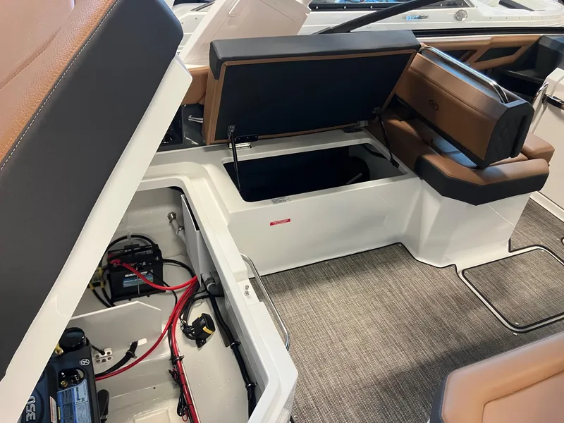 Slide: The Image of 2025 Cobalt R6 boat interior showing storage compartments and battery setup. - 7