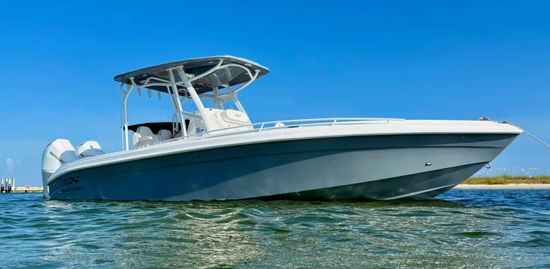 The Image of 2026 Glasstream 280 Pro-X "Fish & Family" boat on clear water under blue sky. - 1