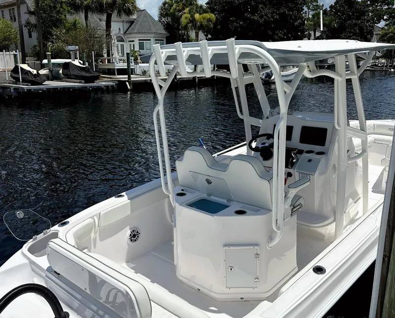 Slide: The Image of 2026 Glasstream 280 Pro-X "Fish & Family" boat docked by waterfront homes. - 3