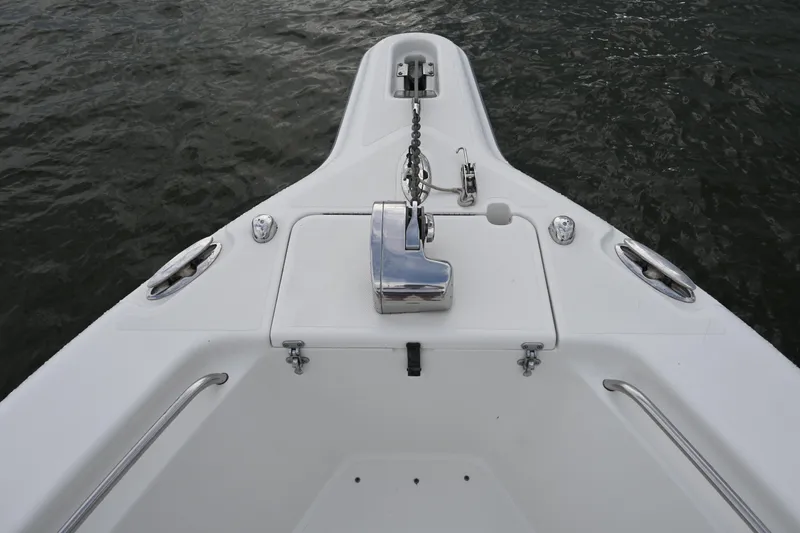 Slide: The Image of Bow of 2002 Triton 2895 CC boat with anchor and stainless steel fittings. - 13