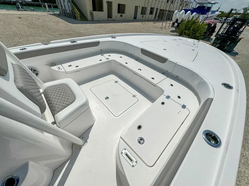 Slide: The Image of 2024 Caymas 28 HB boat interior with seating and storage compartments. - 16