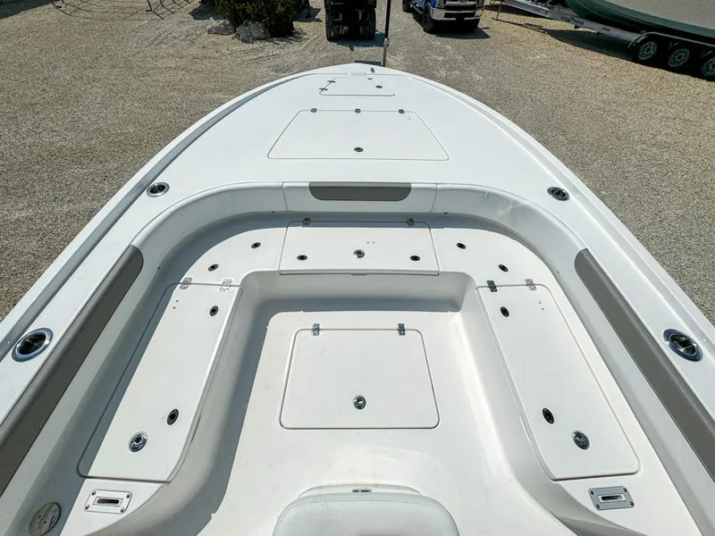 Slide: The Image of 2024 Caymas 28 HB boat deck with storage compartments, viewed from above. - 17