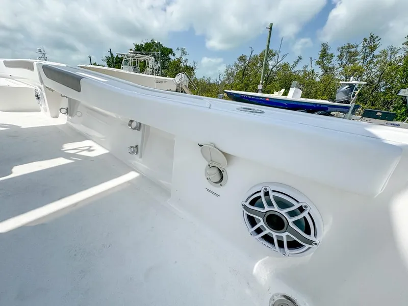Slide: The Image of 2024 Caymas 28 HB boat deck with speaker and storage compartments. - 24