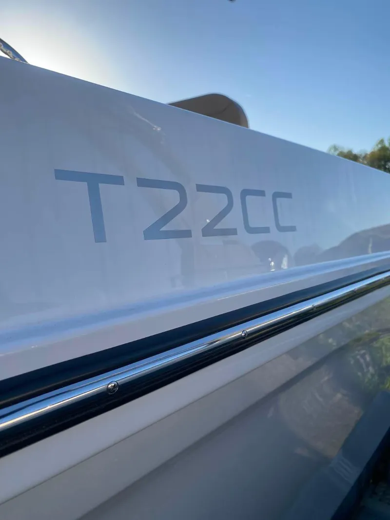 Slide: The Image of 2025 Bayliner Trophy T22CC boat side view with model name visible. - 3