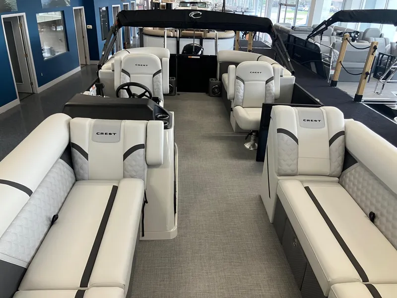 Slide: The Image of 2025 Crest 240 SLC Classic LX pontoon boat interior with luxurious seating and modern design. - 6