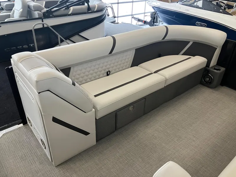 Slide: The Image of 2025 Crest 240 SLC Classic LX boat interior with sleek white seating and modern design. - 8