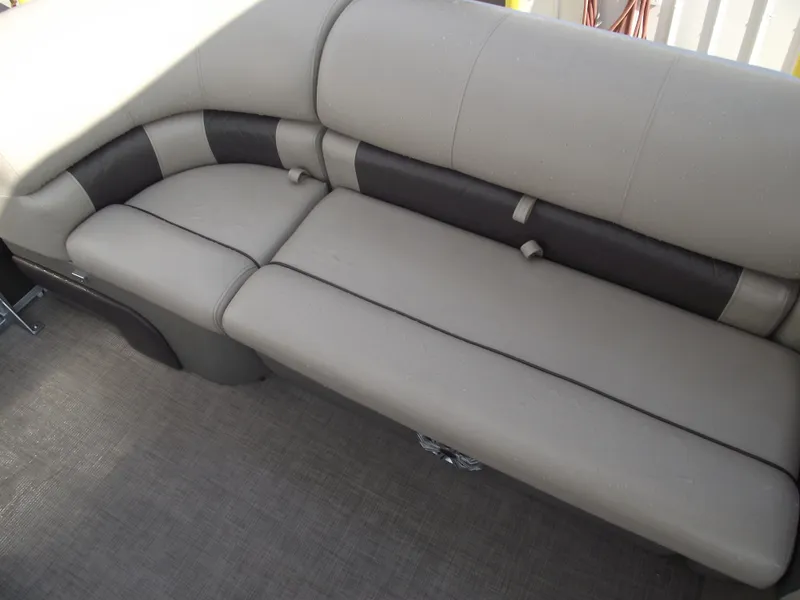 Slide: The Image of 2023 Sun Tracker Party Barge 20 DLX interior seating, featuring comfortable beige upholstery. - 12