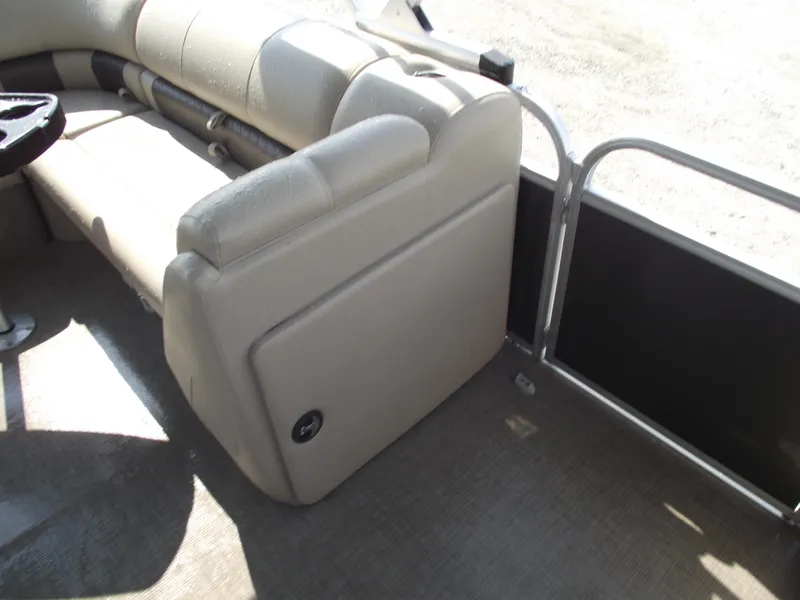 Slide: The Image of 2023 Sun Tracker Party Barge 20 DLX interior with beige seating and railing. - 16