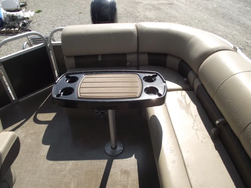 Slide: The Image of 2023 Sun Tracker Party Barge 20 DLX interior with seating and table. - 23