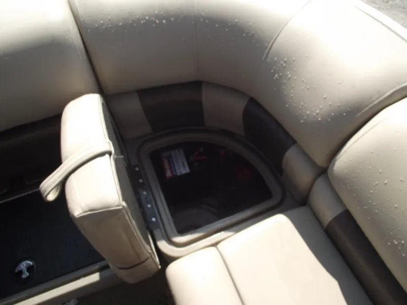 Slide: The Image of 2023 Sun Tracker Party Barge 20 DLX interior seating with storage compartment. - 28