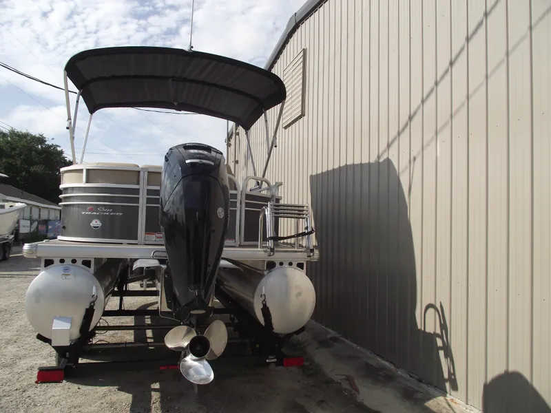 Slide: The Image of 2023 Sun Tracker Party Barge 20 DLX pontoon boat with canopy and outboard motor. - 3
