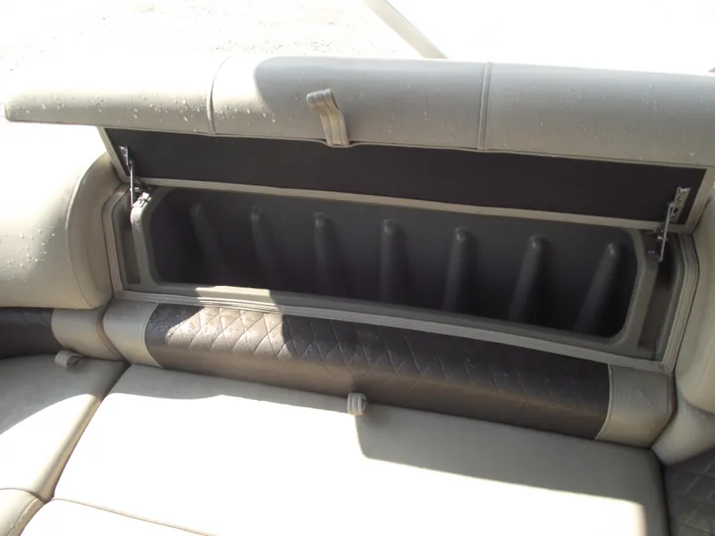 Slide: The Image of 2023 Sun Tracker Party Barge 20 DLX storage compartment with open cushioned seat. - 30