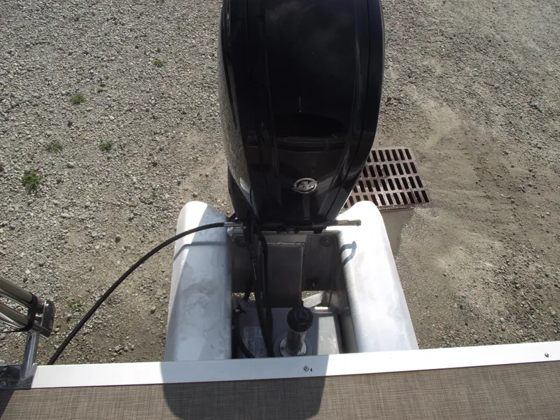 Slide: The Image of 2023 Sun Tracker Party Barge 20 DLX outboard motor on gravel surface. - 33