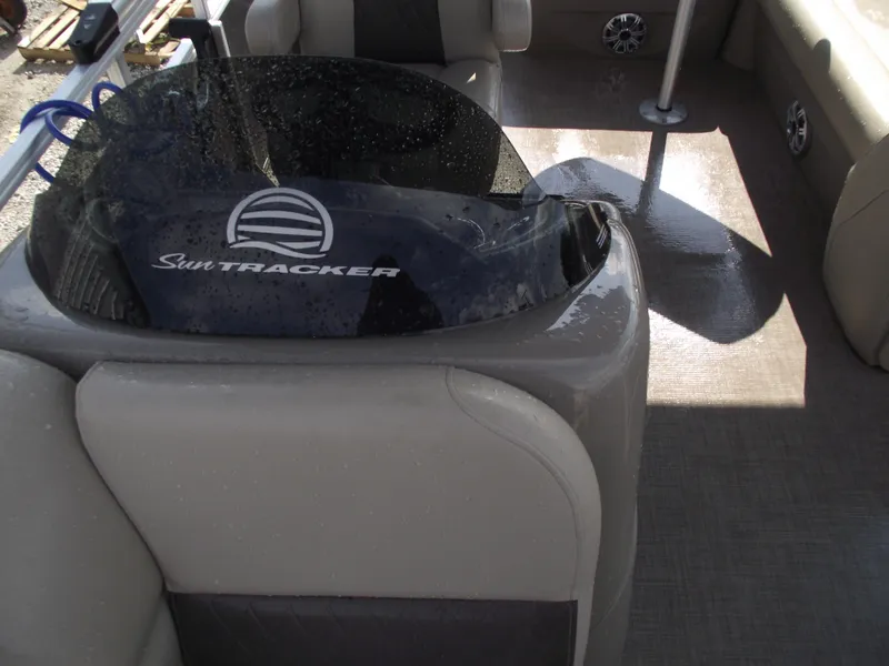 Slide: The Image of 2023 Sun Tracker Party Barge 20 DLX interior with wet seats and steering console. - 34