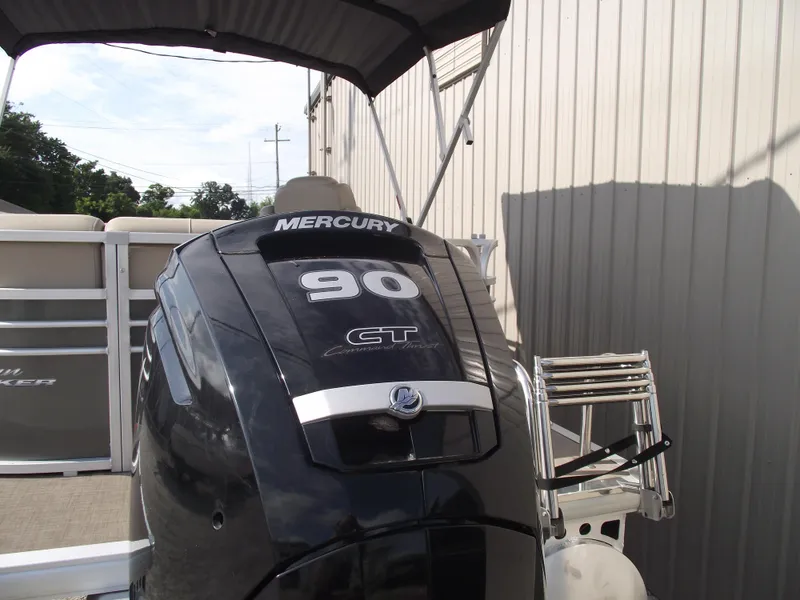 Slide: The Image of 2023 Sun Tracker Party Barge 20 DLX with Mercury 90 HP engine, docked outdoors. - 4