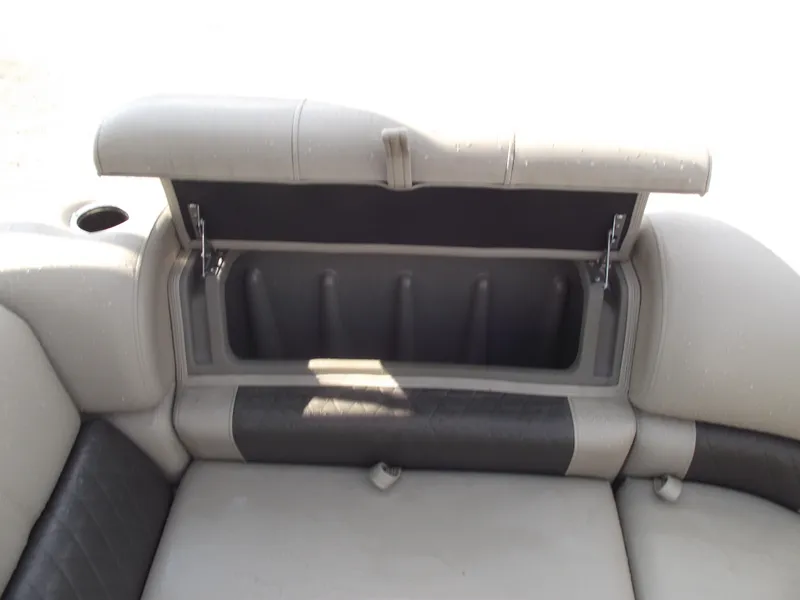 Slide: The Image of 2023 Sun Tracker Party Barge 20 DLX storage compartment with open lid. - 9