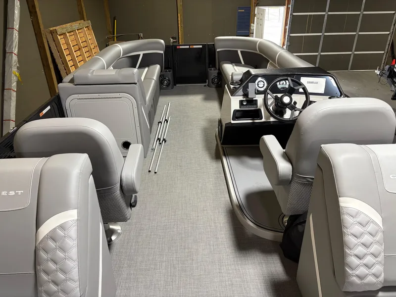 Slide: The Image of 2025 Crest 240 SLC pontoon boat interior with luxurious gray seating and modern dashboard. - 5