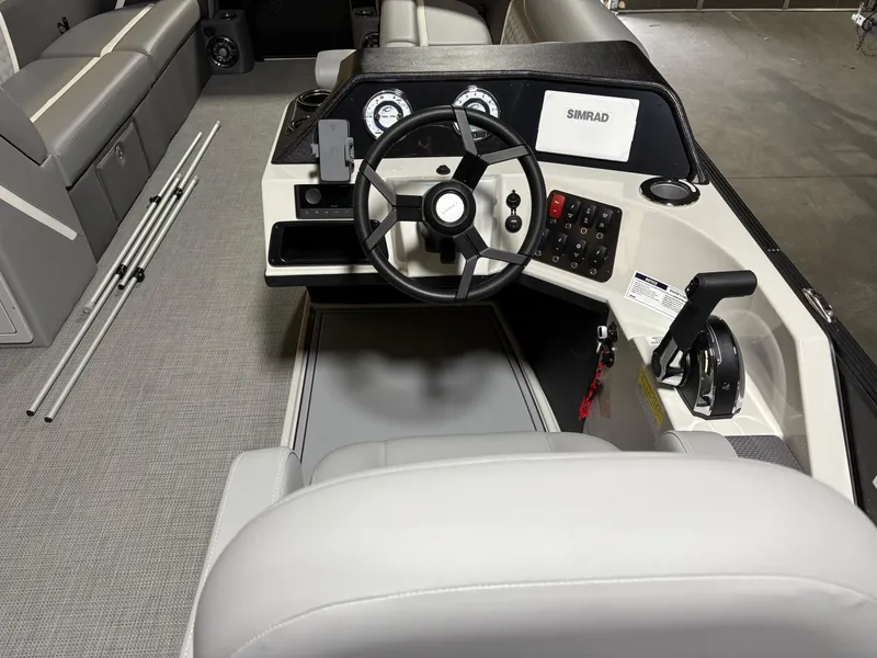 Slide: The Image of 2025 Crest 240 SLC boat interior with steering wheel and control panel. - 7