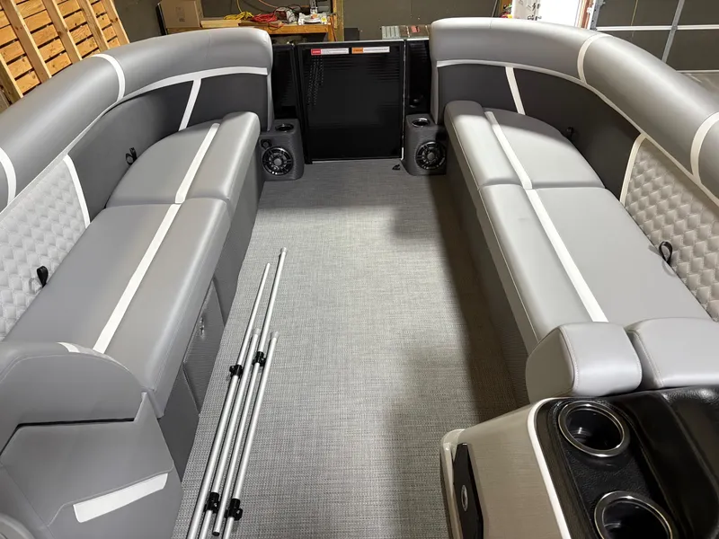 Slide: The Image of Interior of 2025 Crest 240 SLC pontoon boat with gray seating and cup holders. - 8