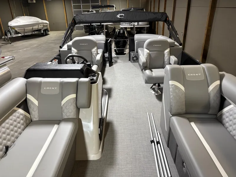 Slide: The Image of 2025 Crest 240 SLC pontoon boat interior with gray seating and modern design. - 9