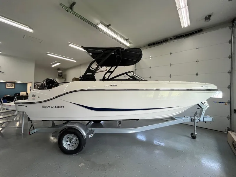Slide: The Image of 2025 Bayliner D20 boat in showroom, side view, on trailer. - 4
