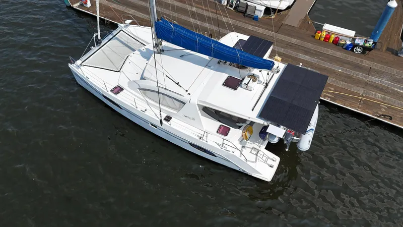 Slide: The Image of Aerial view of a 2012 Leopard 39 Owner's Version catamaran docked at a marina. - 13