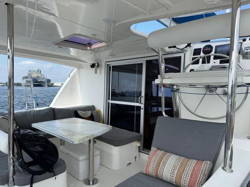 Slide: The Image of Leopard 39 Owner's Version yacht interior with seating, table, and steering wheel, 2012 model. - 16