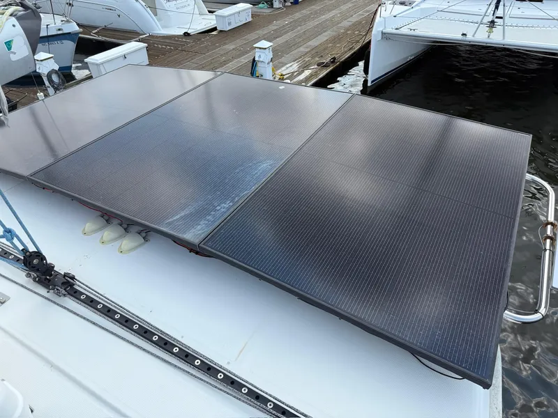 Slide: The Image of Solar panels on a 2012 Leopard 39 Owner's Version catamaran at a marina. - 22