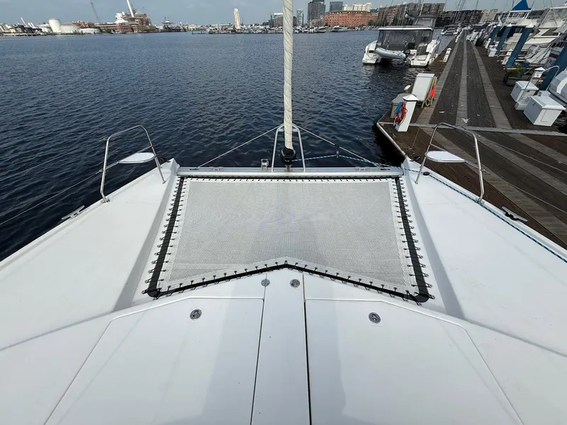 Slide: The Image of Leopard 39 Owner's Version catamaran docked at marina, 2012 model, with netting on deck. - 25