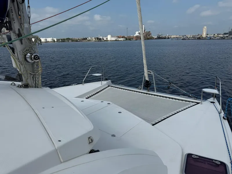 Slide: The Image of Leopard 39 Owner's Version catamaran on calm water, 2012 model, with cityscape in background. - 26