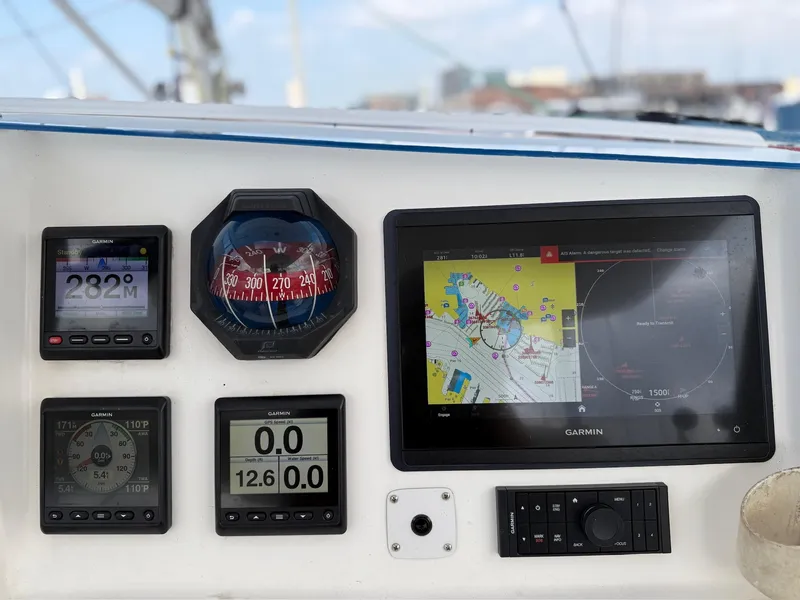 Slide: The Image of Control panel of a 2012 Leopard 39 Owner's Version yacht with navigation instruments. - 29