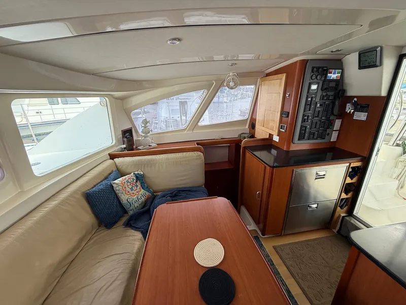 Slide: The Image of Interior of 2012 Leopard 39 Owner's Version yacht with cozy seating and modern amenities. - 34