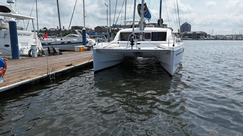 Slide: The Image of 2012 Leopard 39 Owner's Version catamaran docked at marina. - 4