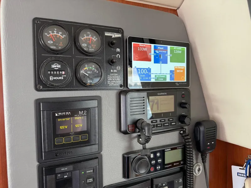 Slide: The Image of Control panel of a 2012 Leopard 39 Owner's Version yacht with gauges and navigation equipment. - 40